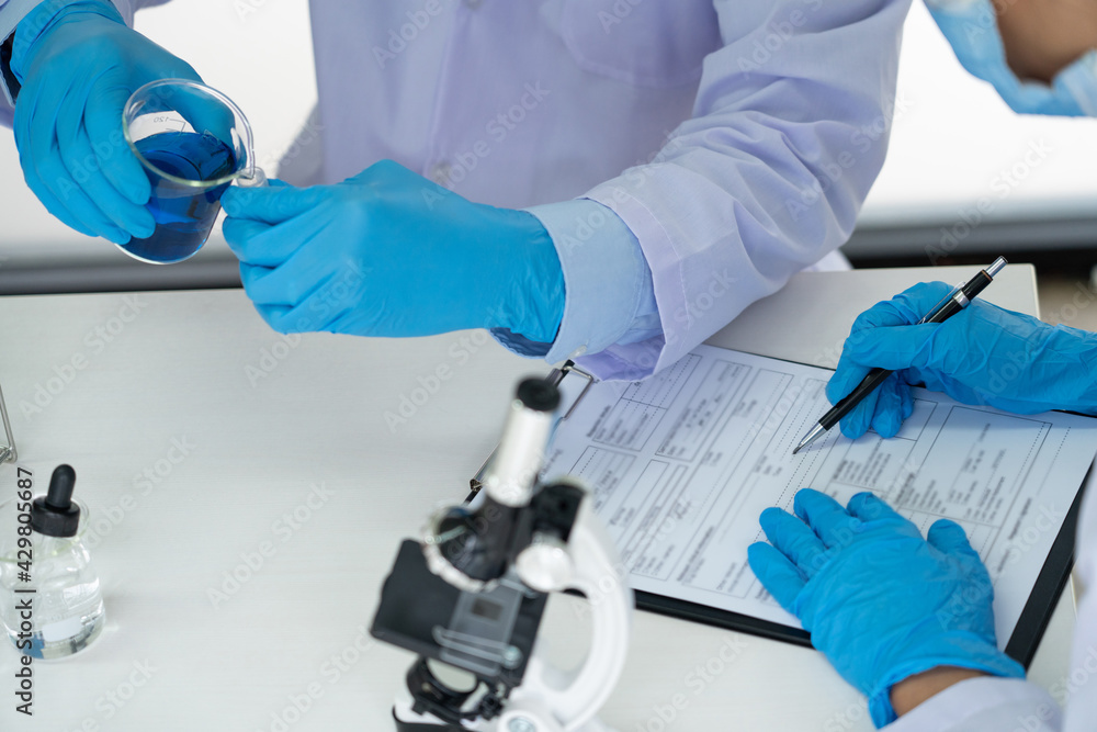 Team of Medical Research Scientists or researcher in lab coat testing their experimental in Modern laboratory. Team of Medical Research Scientists or researcher in lab coat testing their experimental in Modern laboratory.