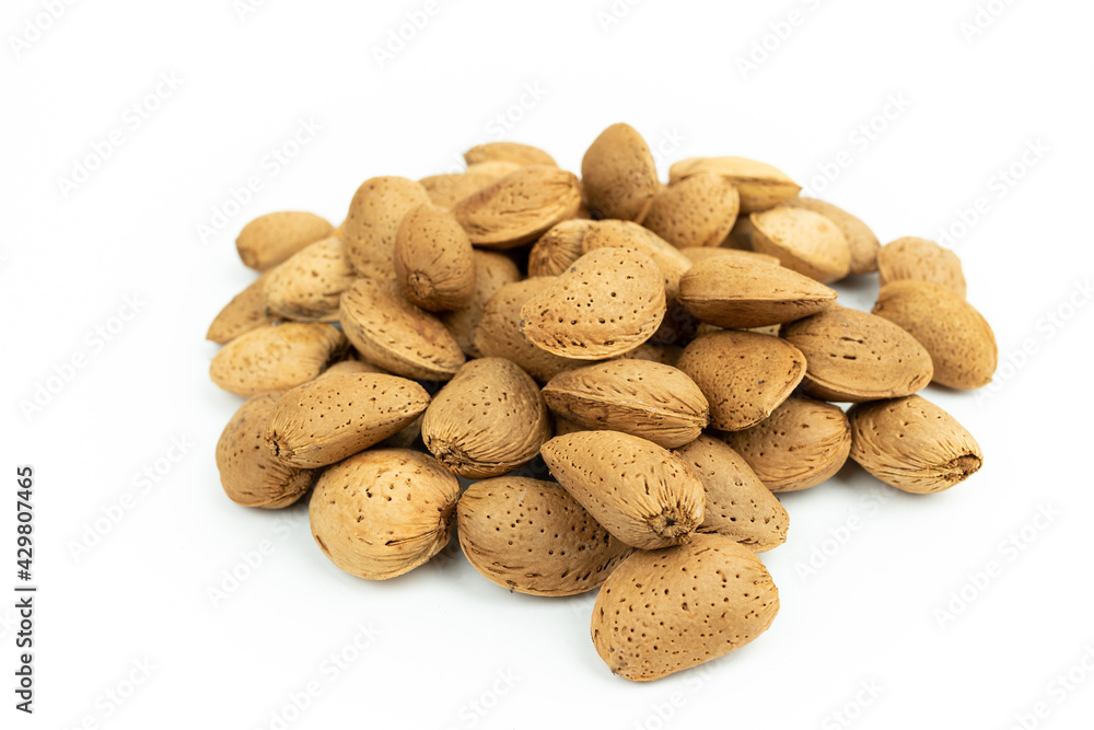 bunch of shelled almonds on a white background bunch of shelled almonds on a white background
