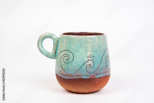 colored ceramic coffee cup on white isolated