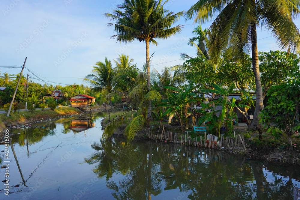 The beautiful village scene of Kampung kuar Jawa, with plantation canal river around the neighbourhood.