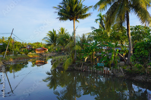 The beautiful village scene of Kampung kuar Jawa  with plantation canal river around the neighbourhood.