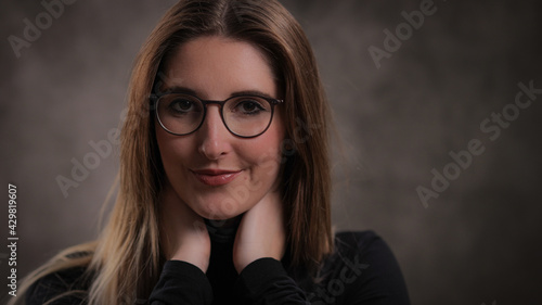 Beautiful girl with long brown hair - close-up shot - studio photography