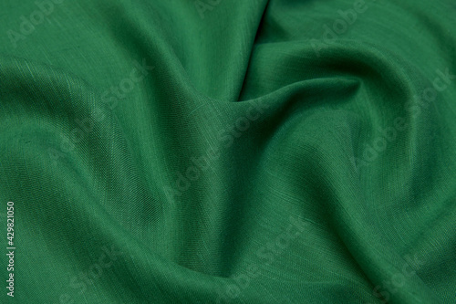 Green Abstract background. Green linen fabric texture, background. Green fabric.
