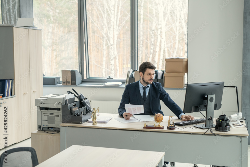 A person sitting at a desk A person sitting at a desk