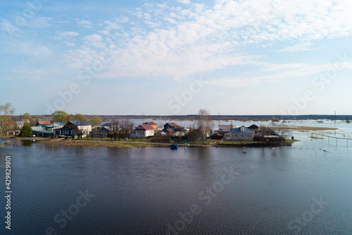 Spring flood in the village on a sunny day in spring © ovcerleonid