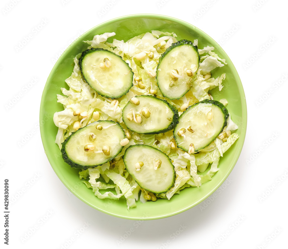Bowl of tasty salad with fresh vegetables on white background Bowl of tasty salad with fresh vegetables on white background
