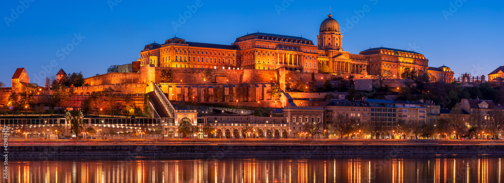 Hungary, Budapest at night, Buda Fortress illuminated by lights, reflected in the water, panorama Hungary, Budapest at night, Buda Fortress illuminated by lights, reflected in the water, panorama
