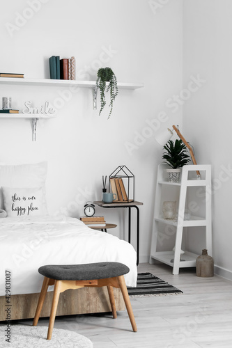 Bedside tables with decor in interior of modern room © Pixel-Shot