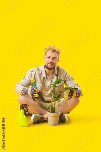 Young male gardener on colo...