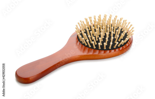 Wooden hair brush on white background