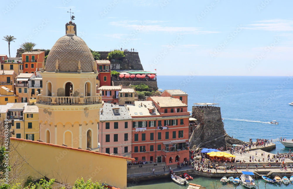 Vernazza Italy is a very colorful town that hangs on the mountainside with my vineyards and is one of five towns that make up the cinque terre region.