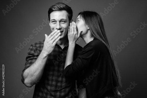 Portrait of young multi ethnic couple together in black and white