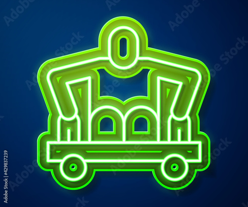 Glowing neon line Man without legs sitting wheelchair icon isolated on blue background. Disability concept. Guy with physical disabilities. Vector