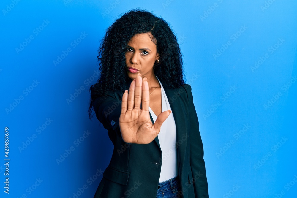 Middle age african american woman wearing business clothes doing stop ...