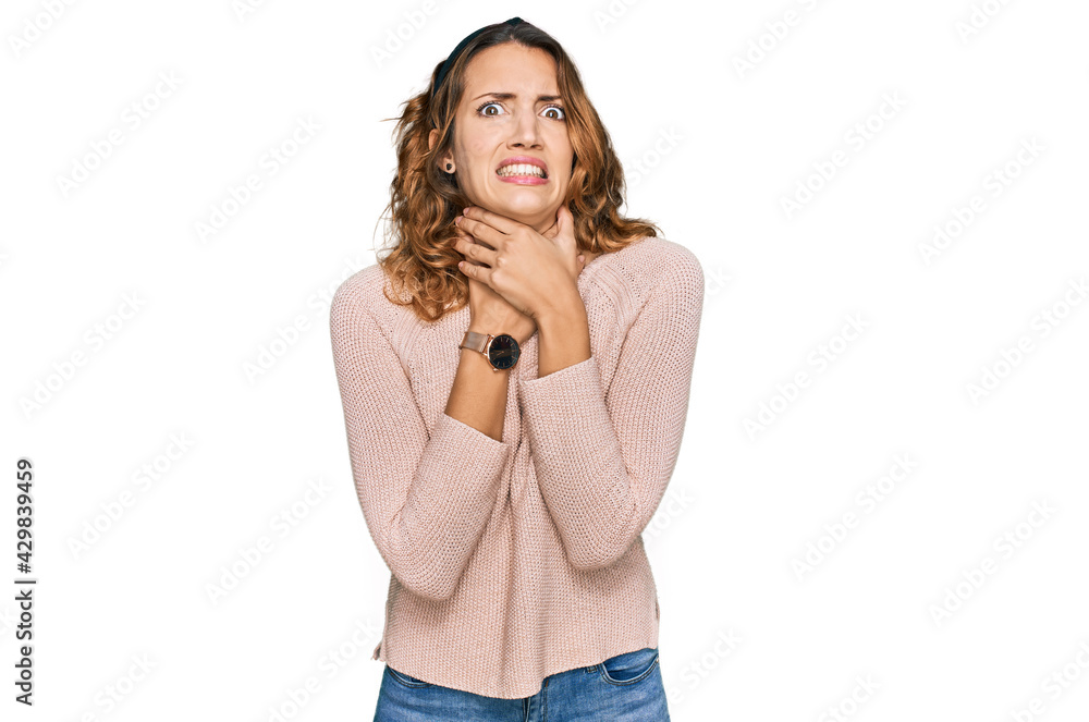 Beautiful young caucasian woman wearing casual sweater shouting suffocate because painful strangle. health problem. asphyxiate and suicide concept. Beautiful young caucasian woman wearing casual sweater shouting suffocate because painful strangle. health problem. asphyxiate and suicide concept.