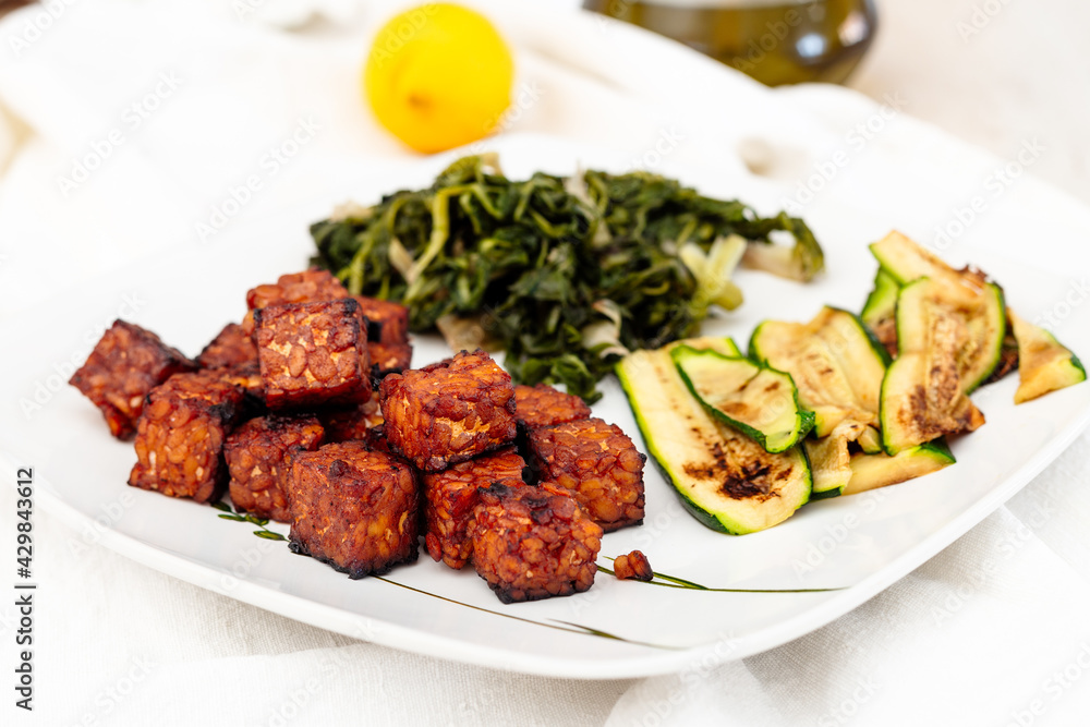 Marinated tempeh baked with vegetables. Vegan recipe Marinated tempeh baked with vegetables. Vegan recipe