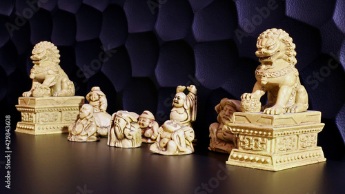 Netsuke collection on black table photo