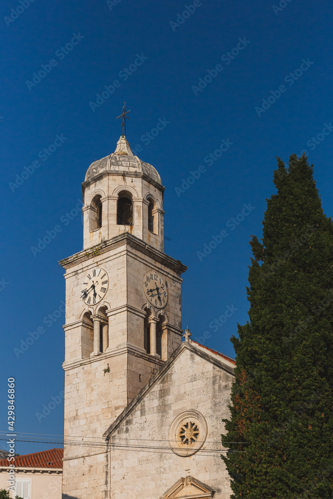 Clock tower of Church of St. Nicolas in the village of Cavtat, Croatia