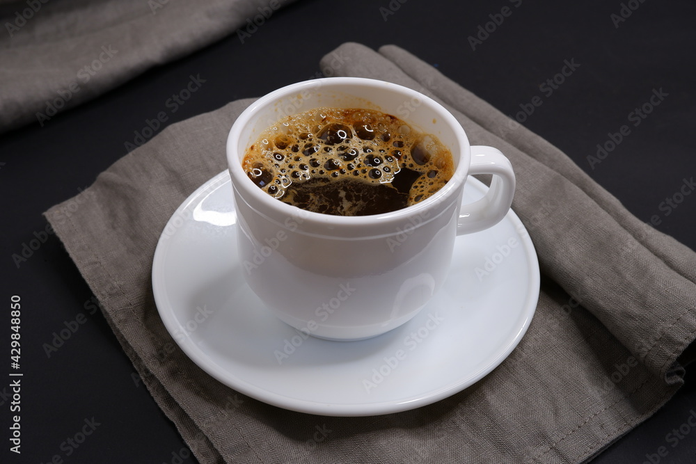 Black coffee on a black background. Delicious drink. Black coffee on a black background. Delicious drink.