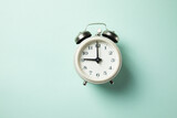 the white  vintage alarm clock