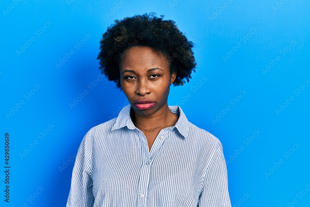 Young african american woman wearing casual clothes skeptic and nervous, frowning upset because of problem. negative person. Young african american woman wearing casual clothes skeptic and nervous, frowning upset because of problem. negative person.