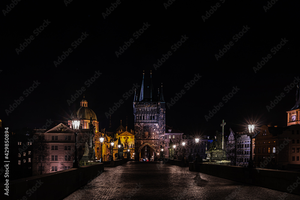 Charles Bridge in Prague is a famous Czech monument, night photo without people