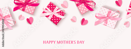 Happy Mothers Day. Holiday design template. Greeting text with decorative gift box, pink tulip flowers and paper hearts. Spring banner. Flat lay. Vector stock illustration