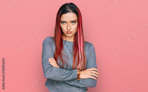 Young caucasian woman wearing casual clothes skeptic and nervous, disapproving expression on face with crossed arms. negative person. © Krakenimages.com