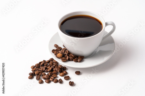 Black coffee and coffee beans isolated on white background.