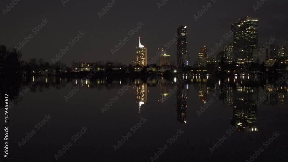 Kaisermühlen, a district in Vienna's 22nd district, viewed from the old Danube with reflections in the Old Danube Kaisermühlen, a district in Vienna's 22nd district, viewed from the old Danube with reflections in the Old Danube