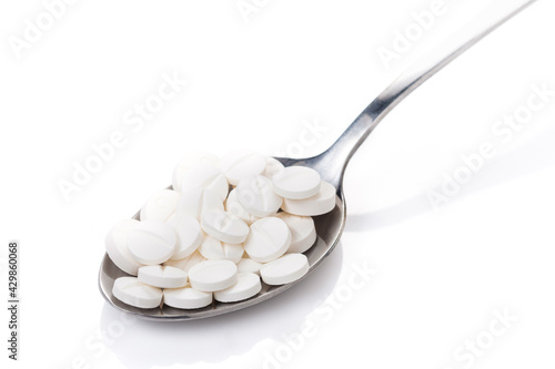 Obraz na plátně Full medicine tablets on a tablespoon, take a food as medicine better than takin