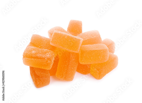 Tasty orange jelly candies on white background