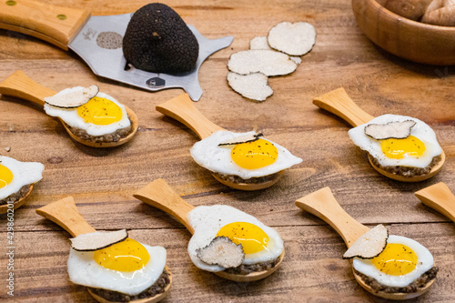 Fototapeta Naklejka Na Ścianę i Meble -  partridge eggs with truffle and mushroom served on a rustic tray
