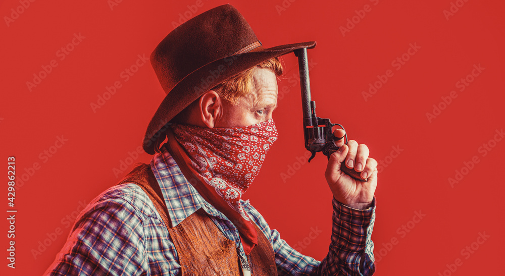 Portrait of a cowboy. West, guns. Portrait of a cowboy. American bandit in mask, western man with hat. Portrait of cowboy in hat Portrait of a cowboy. West, guns. Portrait of a cowboy. American bandit in mask, western man with hat. Portrait of cowboy in hat