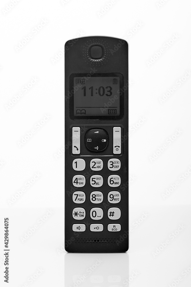 vertical receiver of a push-button telephone of black color on a white background vertical receiver of a push-button telephone of black color on a white background