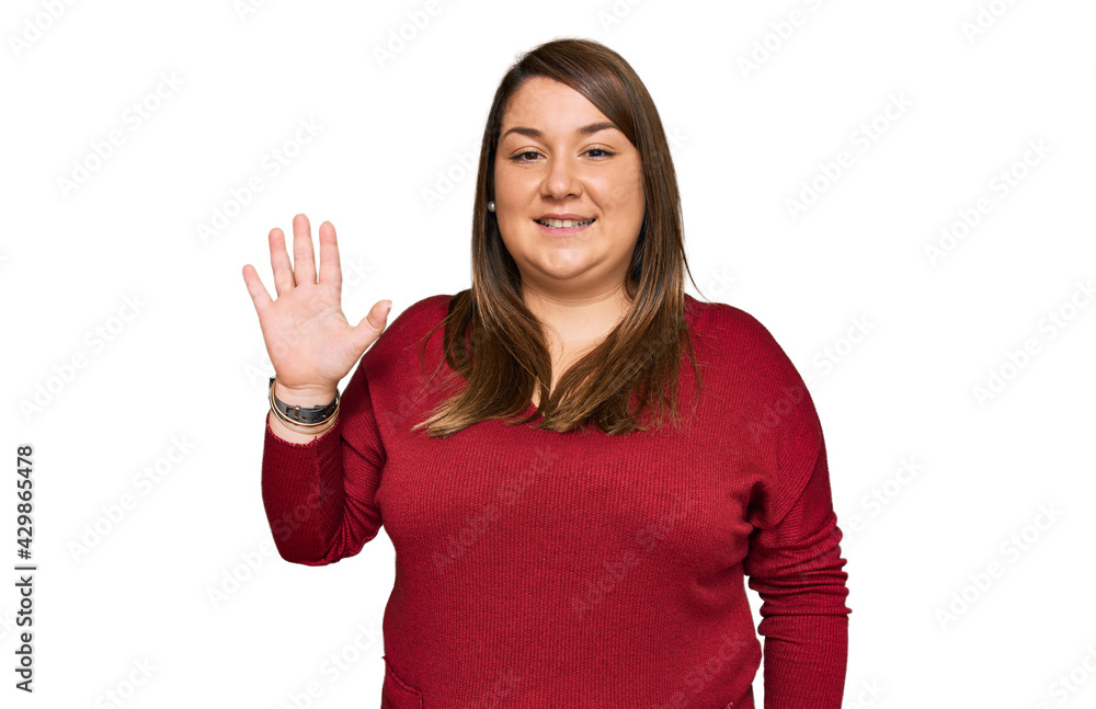 Beautiful brunette plus size woman wearing casual clothes showing and pointing up with fingers number five while smiling confident and happy. Beautiful brunette plus size woman wearing casual clothes showing and pointing up with fingers number five while smiling confident and happy.