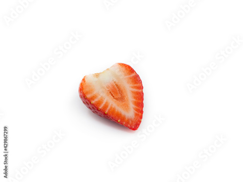 Red, fresh, ripe early spring half strawberries in a cut on a white background. A photo of a real berry without foliage, a lifestyle without processing and retouching.