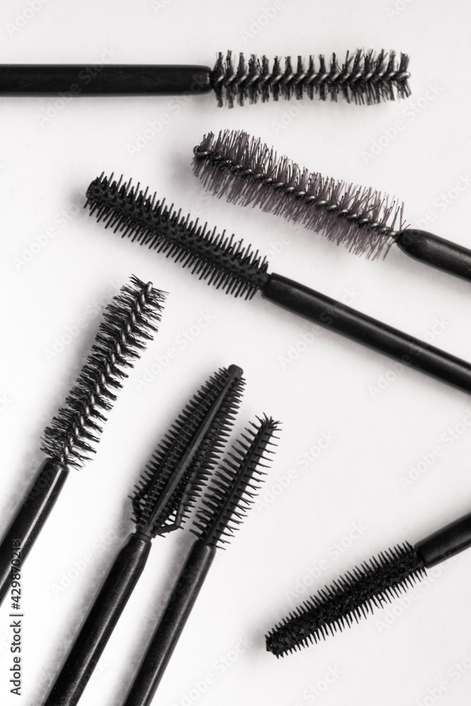 Assortment of brushes of black mascara texture Assortment of brushes of black mascara texture