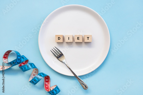 white plate with the message DIET spelt out in the middle of the plate
