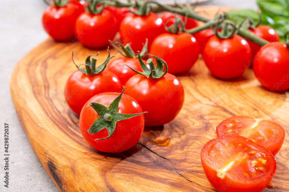 Ripe small round sweet red cherry tomatoes close up Ripe small round sweet red cherry tomatoes close up