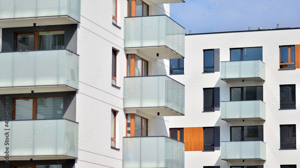 Architectural details of modern apartment building. Modern european residential apartment building complex with sunlight. Architectural details of modern apartment building. Modern european residential apartment building complex with sunlight.