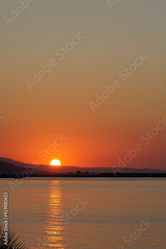 Sunset over the hills and the sea