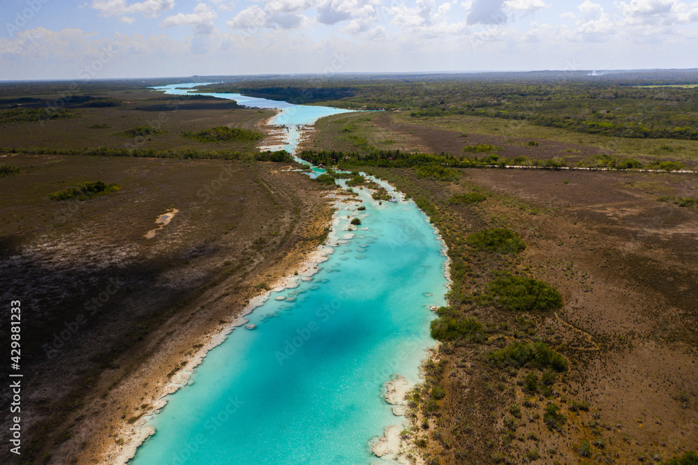 Bacalar lagoon with crystal blue water. Los Rapidos, Mexico.