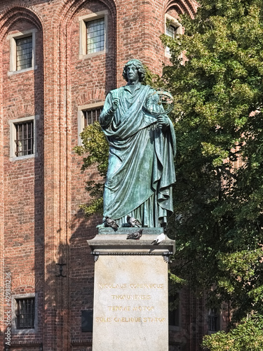 Nicolaus Copernicus Monument in Torun, Poland. The monument was erected in 1853. Latin text on the pedestal reads: Nicolaus Copernicus of Torun, mover of the earth, stopper of the sun and heavens.