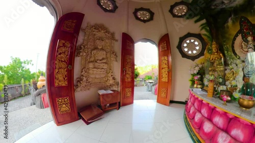 Statue of the Buddha god in the Buddhist temple Brahma Vihara Arama with statues of the gods on Bali island, Indonesia. Bali Architecture, Ancient design. Travel concept. photo