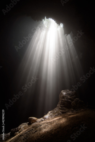 Light from the top of Jomblang Cave in Java island, Indonesia