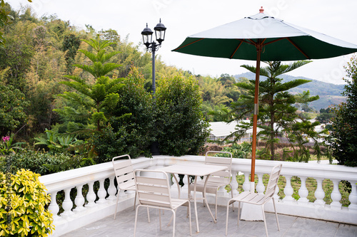 garden furniture and sun umbrella, garden with family relaxing zone, balcony