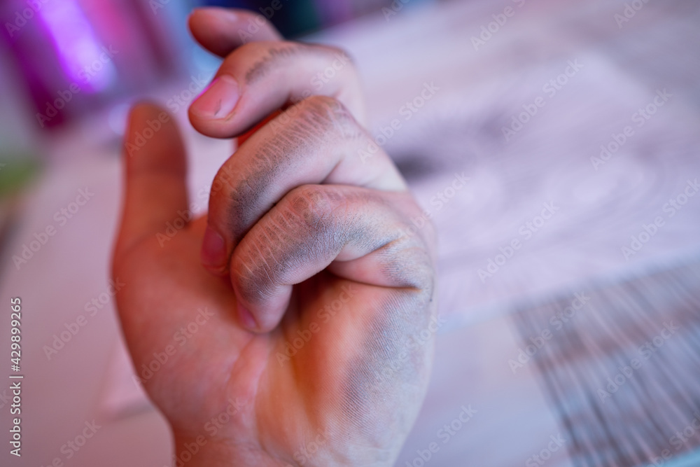 man shows the problem lefties dirty hand after writing close-up international left handers day. man shows the problem lefties dirty hand after writing close-up international left handers day.