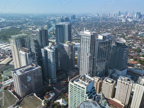 Aerial of Eastwood City skyline and distant BGC and Ortigas further ahead. photo
