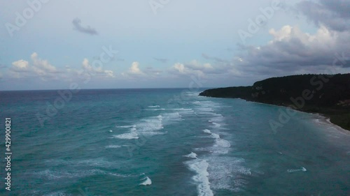 Aerial of Waves Crashing Against Caribbean Beach